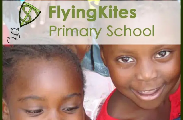 Two smiling children close together, one wearing a red top, with a translucent banner reading 'FlyingKites Primary School' at
